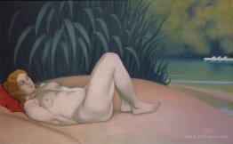 Naked woman sleeping at the edge of the water