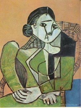 Woman sitting in an armchair