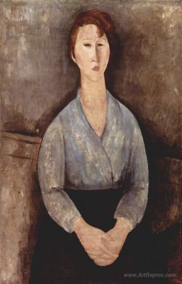 Seated woman weared in blue blouse