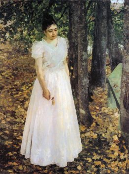 Autumn.Young Woman in a Garden