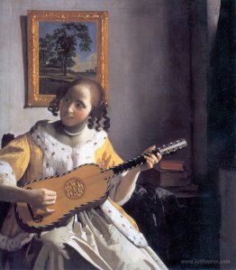 Youg woman playing a guitar