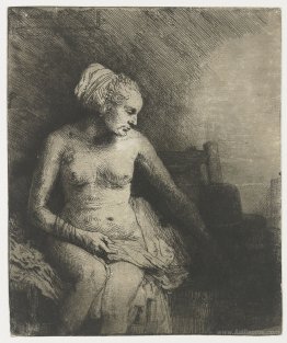 A woman at the bath with a hat beside her