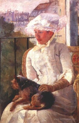 Susan on a balcony holding a dog