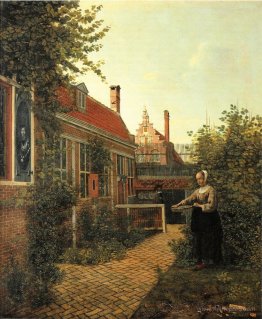 Woman with basket of beans in the kitchen garden