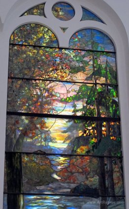 Window with autumn sunset in the forest