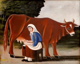 Woman milks a cow