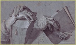 Two Hands Holding A Pair Of Books