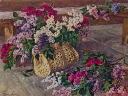 Lilacs in a purse on the floor