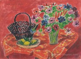 Vase of anemones, lemons and basket on the table