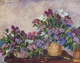 Still Life. Lilacs in two baskets.