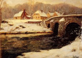 A Stone Bridge Over a Stream in Winter