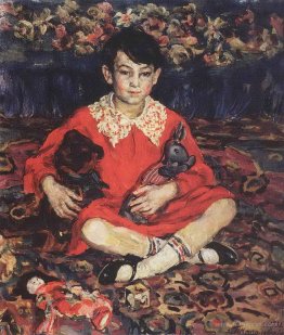 Portrait of girl sitting on a colorful carpet with the toys. (Ka