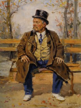 Portrait of a man sitting on a park bench