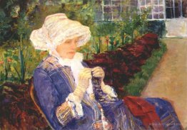 Lydia crocheting in the garden at marly