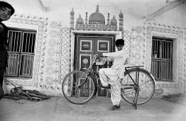 A boy with a bicycle in Dhordo, Gujarat