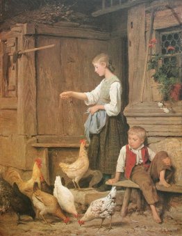 Young girl feeding the chickens