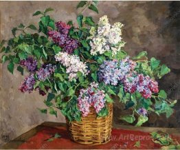 Still Life. Lilacs in a basket.