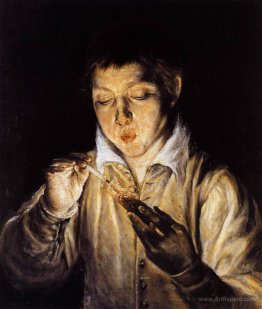 A boy blowing on an ember to light a candle